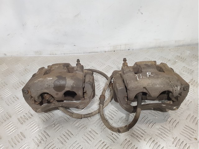 Суппорт тормозной, передний, правый L2Z63398ZA MAZDA