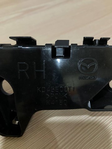 KD45500T1 MAZDA Кронштейн бампера переднего внешний правый купить в Чернигов