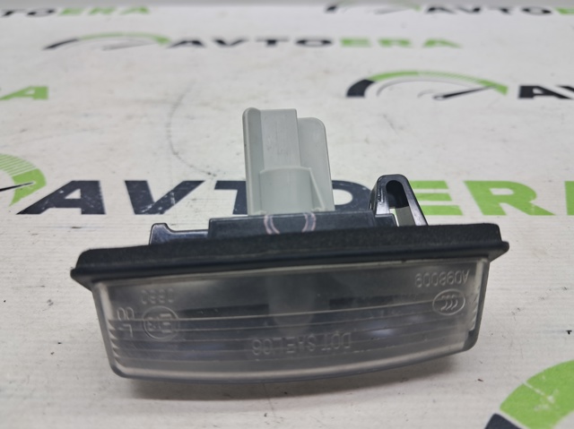 Фонарь подсветки заднего номера 265108991B NISSAN