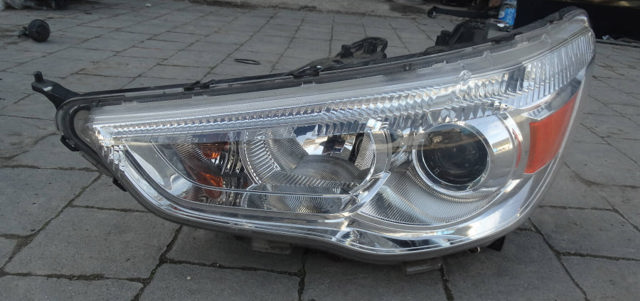 Фара левая 8301B587 MITSUBISHI