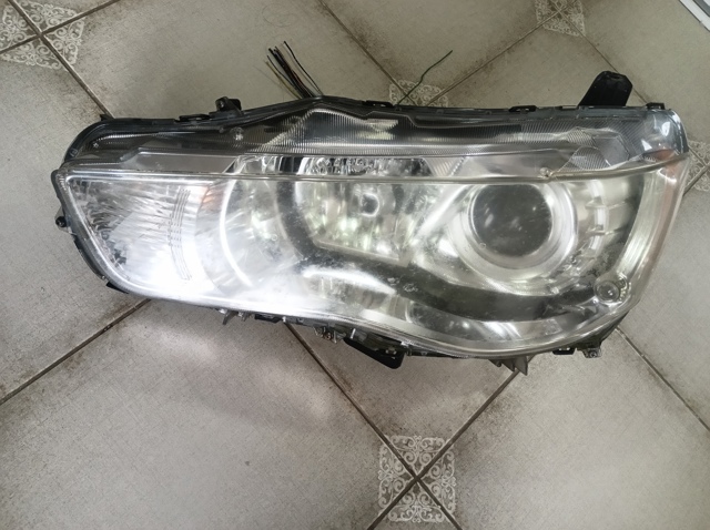 Вставка фары левой 8301A705 MITSUBISHI