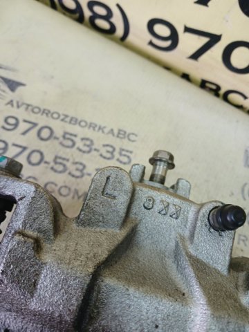 Суппорт тормозной, передний, левый 410113TA0C NISSAN