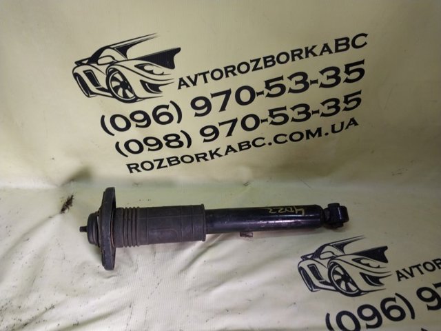 Амортизационная стойка задняя E62105AA0C NISSAN