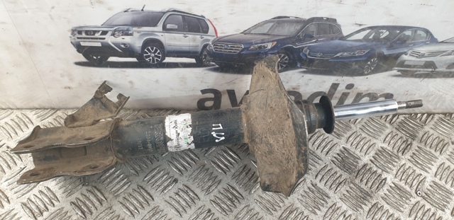Стойка передняя левая 543038H726 NISSAN