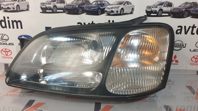 Фара левая 84001AE210 SUBARU