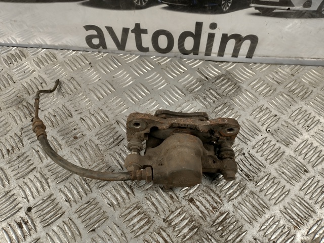 Суппорт тормозной левый задний MR955065 MITSUBISHI