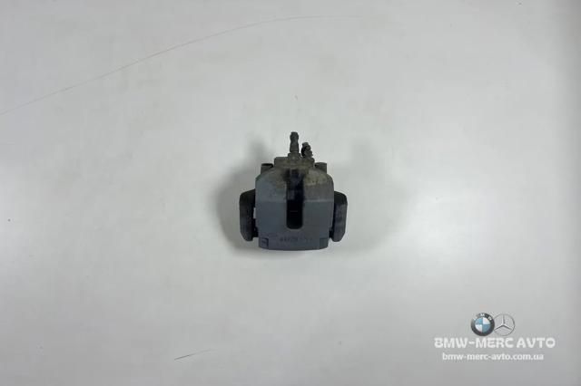 34216776787 BMW Суппорт тормозной задний левый купить в Днепр
