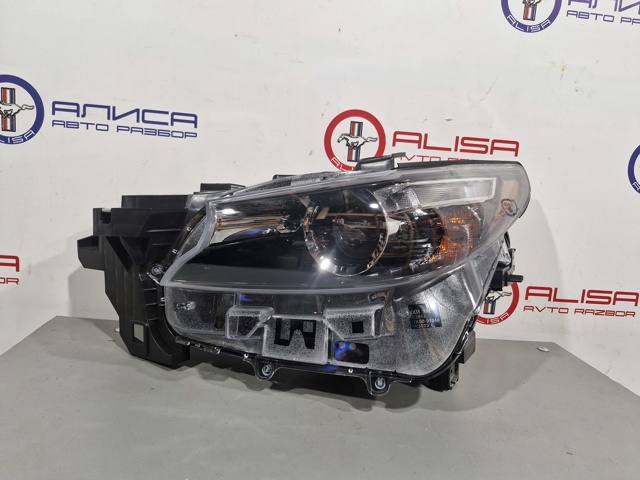Вставка фары левой TK4951040 MAZDA