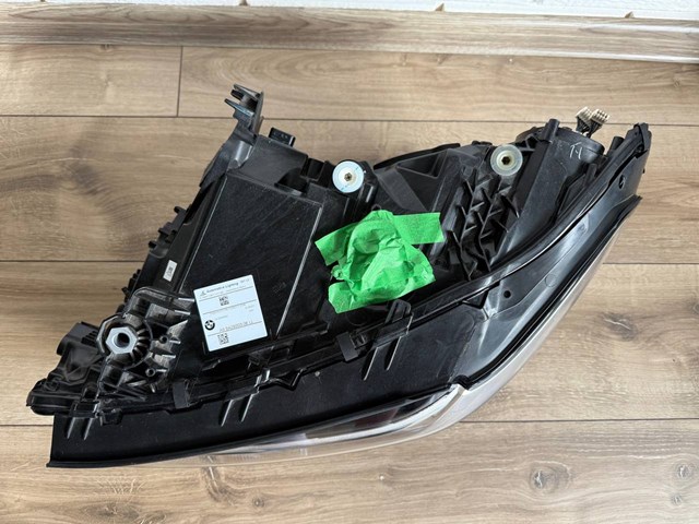Фара левая передняя 63115A0E5F5 BMW
