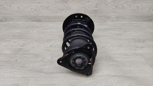Стойка передняя левая E43035HL0A NISSAN