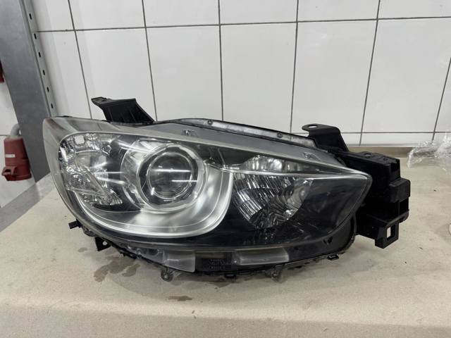 Вставка фары правой KD5451030G MAZDA
