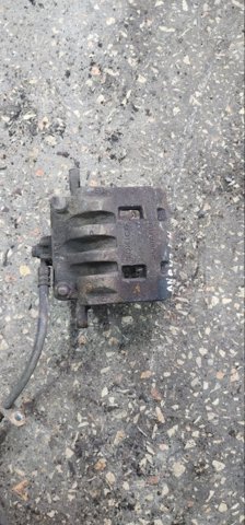 Суппорт тормозной, передний, левый 26292SC010 SUBARU