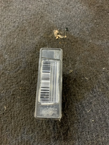 Фонарь подсветки заднего номера 26510JD00A NISSAN