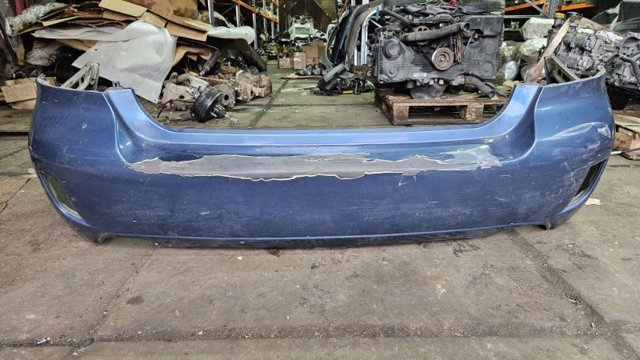 Задний бампер 57704AG250 SUBARU