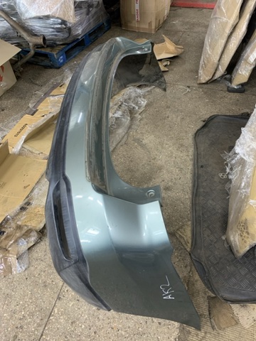 Задний бампер 57704SG010 SUBARU