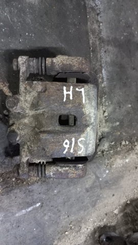 Тормозной суппорт задний левый 583102PA70 HYUNDAI