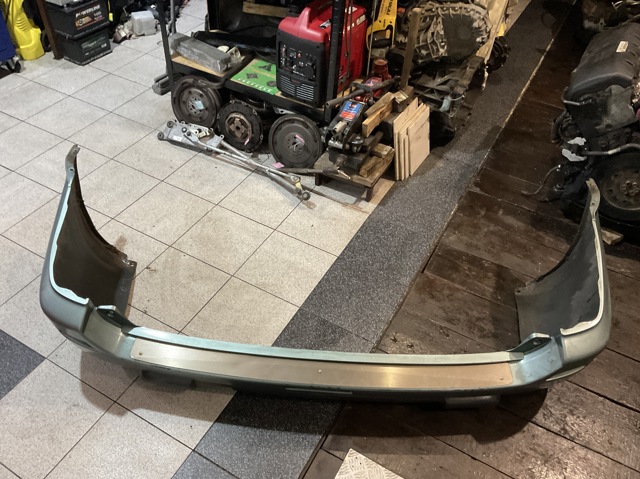 Бампер задний 850228H340 NISSAN