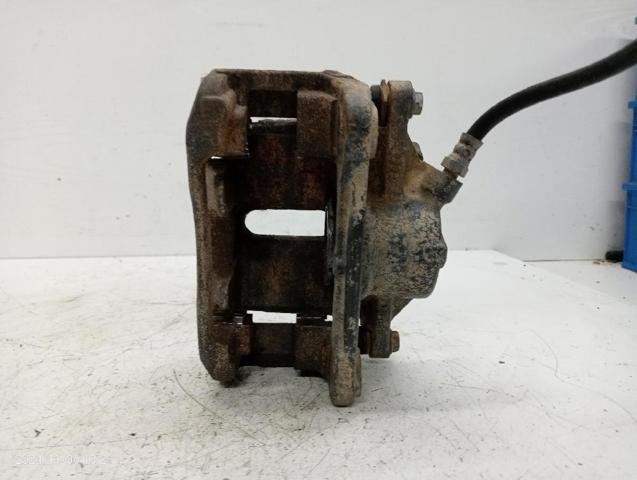 7701207786 RENAULT Суппорт тормозной передний левый купить в Ирпень