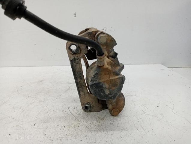 7701207786 RENAULT Суппорт тормозной передний левый купить в Харьков