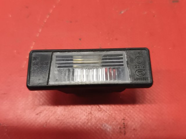 Фонарь подсветки заднего номера 265108990A NISSAN