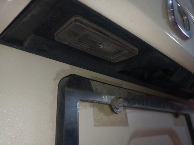 Фонарь освещения номерного знака 265108990E NISSAN
