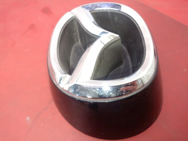 KA0G51730 MAZDA Эмблема решетки радиатора купить в Павлоград
