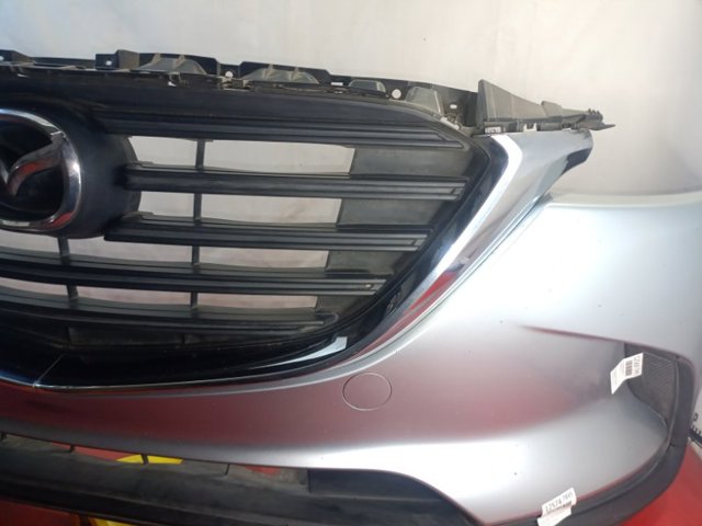 Молдинг решетки радиатора, левый TK48507K1A MAZDA