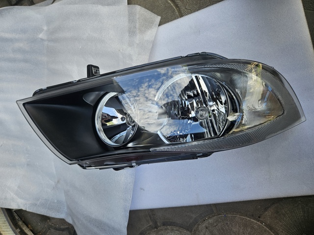 Вставка фары правой 6942722 BMW