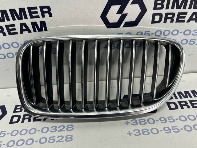 Решетка радиатора левая 51137203649 BMW