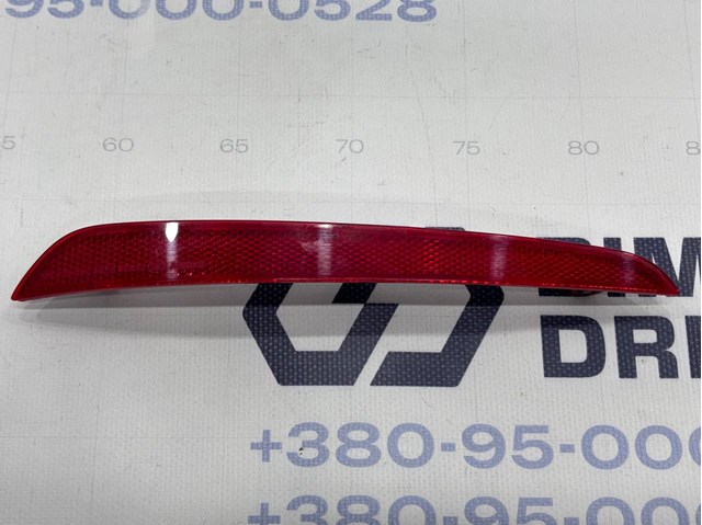 Левый катафот заднего бампера 63147388765 BMW