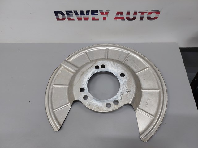 Пыльник тормозного диска заднего правый JX6Z2C028B FORD