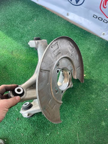 104441100F Tesla Model Цапфа задняя левая купить в Николаев