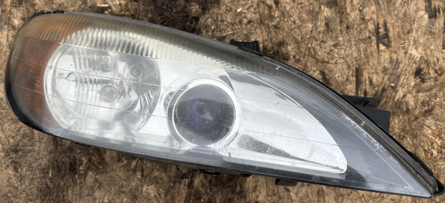 Вставка фары правой 260109F628 NISSAN