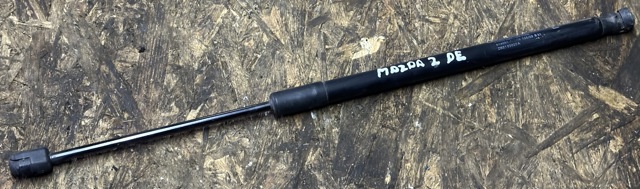 Амортизатор крышки багажника D65163620A MAZDA