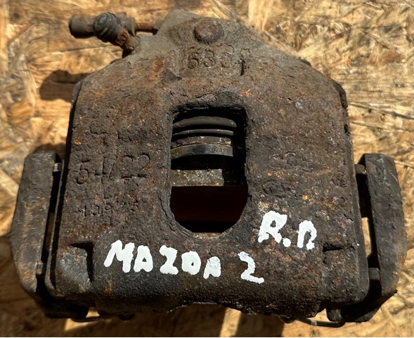Суппорт тормозной, передний, правый DDY23361X MAZDA