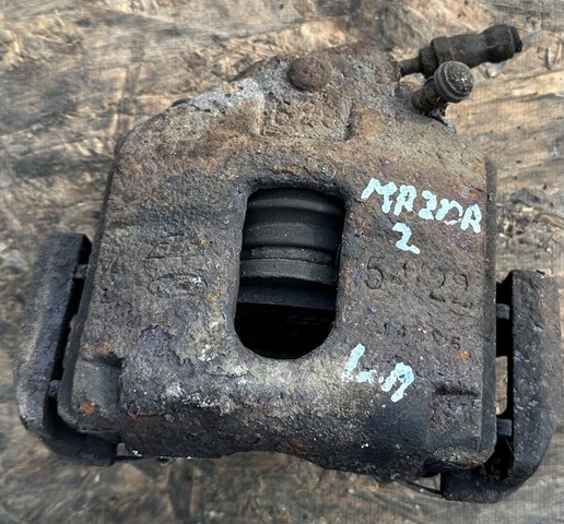 DDY23371X MAZDA Суппорт тормозной передний левый купить в Киев
