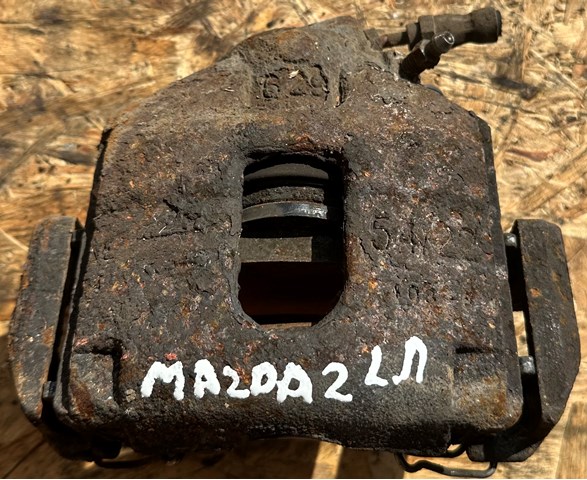 Суппорт тормозной передний левый DDY23371X MAZDA