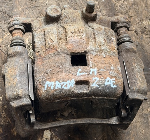 Суппорт тормозной передний левый DF7133990C MAZDA