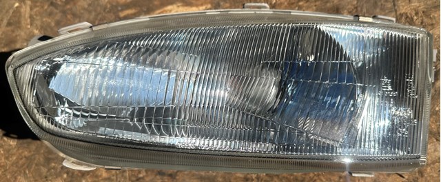 Фара основная левая MR273413 MITSUBISHI