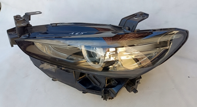 Основная фара в сборе левая GRF551040 MAZDA