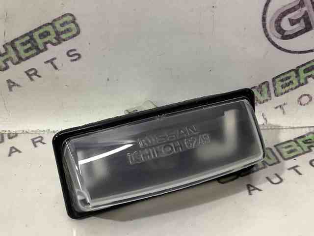 Фонарь подсветки заднего номера 265108991B NISSAN