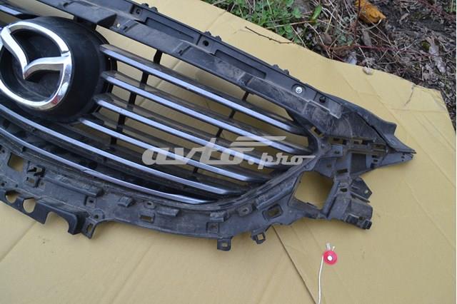 Эмблема решетки радиатора G46M50716 Mazda