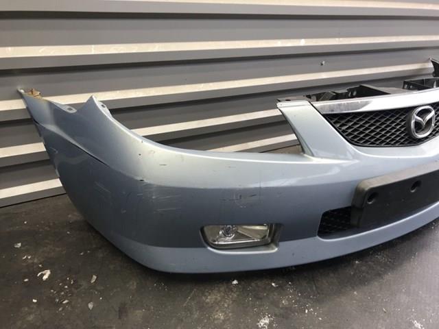 Передний бампер B30K50031 Mazda