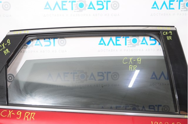 Стекло двери задней правой TK4872510 Mazda