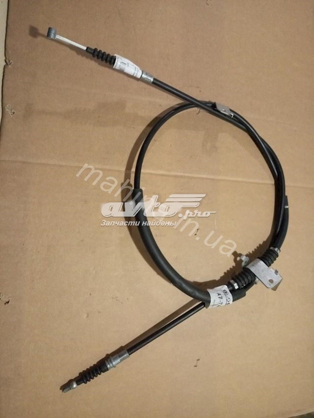 Купить 1064001077 Geely Задний правый трос ручника