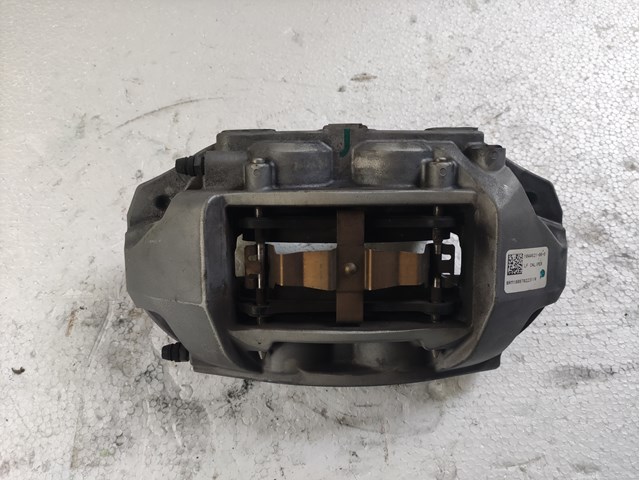 104462100D Tesla Суппорт тормозной, передний, левый