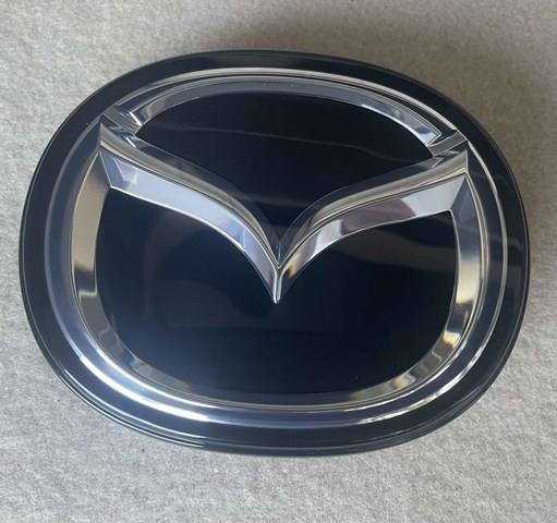 Эмблема решетки радиатора BERC51730 Mazda