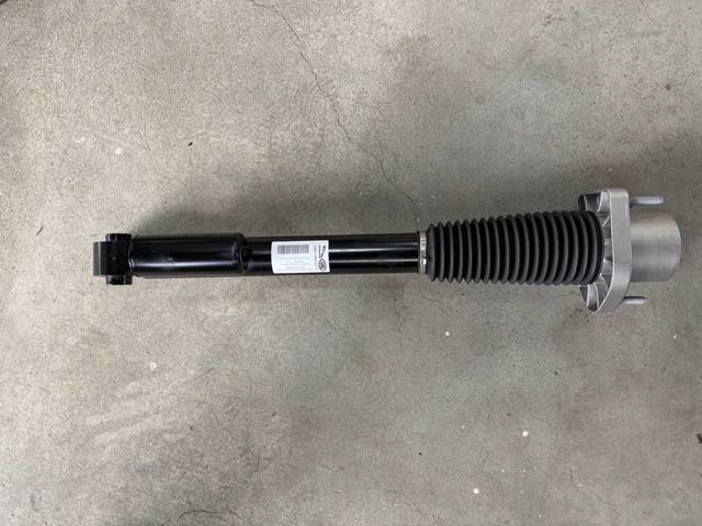 LR140076 Land Rover Амортизатор задней подвески, левый