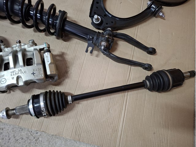 FD052560X Mazda Полуось передняя левая