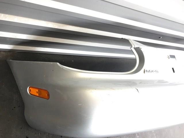 Купить NC1050221 Mazda Задний бампер